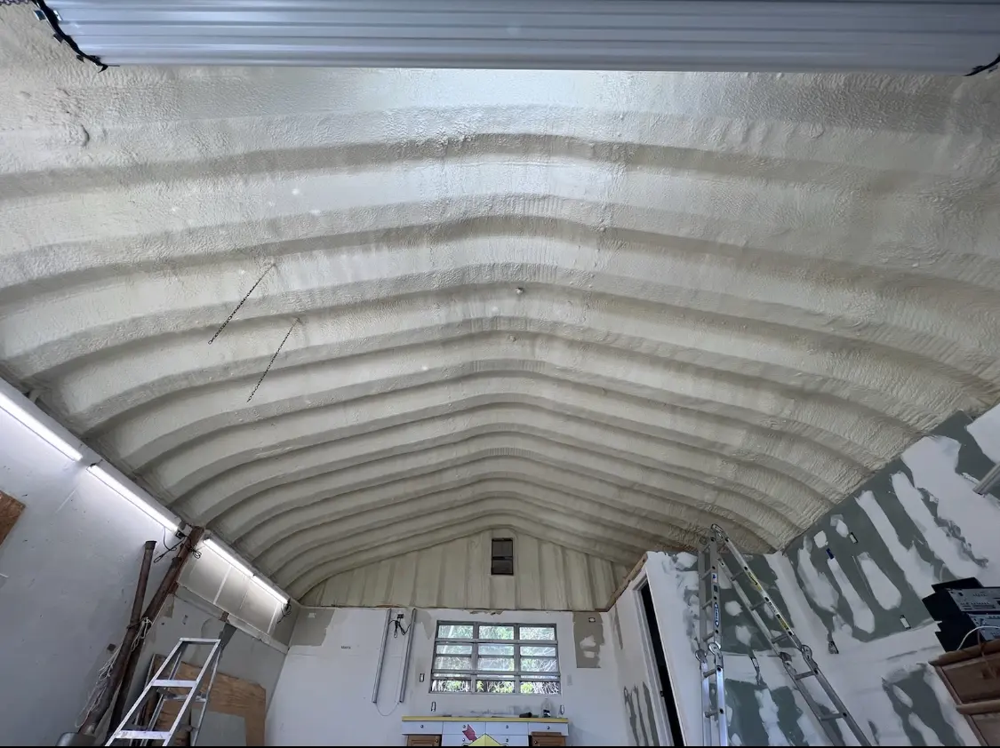 Spray polyurethane foam applied to the underside of a metal roof deck in La Feria